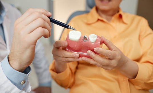 Woman listening to dentist during consultation