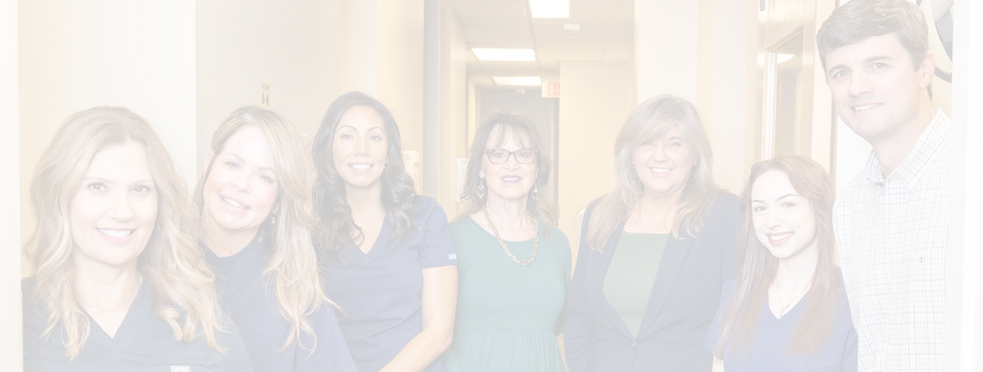 Dr. Bell with other members of dental team