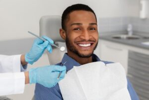 Man smiling at his dental checkup